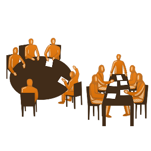 Team members sitting around a table engaged in a structured and productive meeting, representing strong meeting processes.
