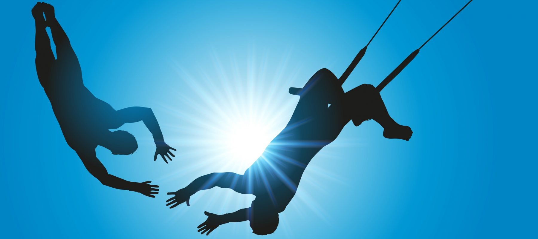 Two people on a trapeze showing the importance of trust